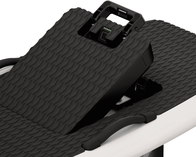 Close-up of Lift eFoil battery compartment with locking latch on textured black deck